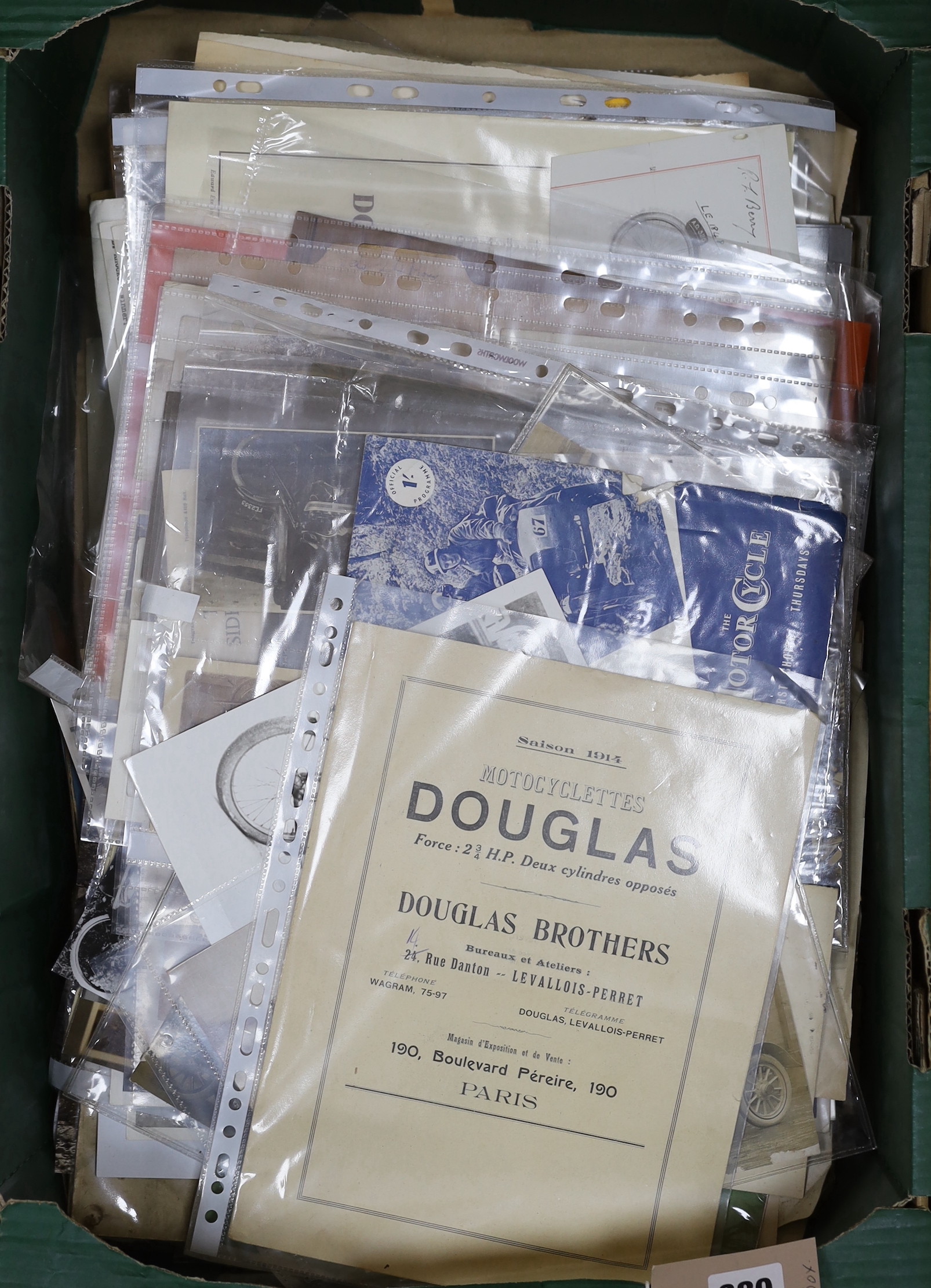 A collection of early motorcycle ephemera, postcards and black and white photographs
